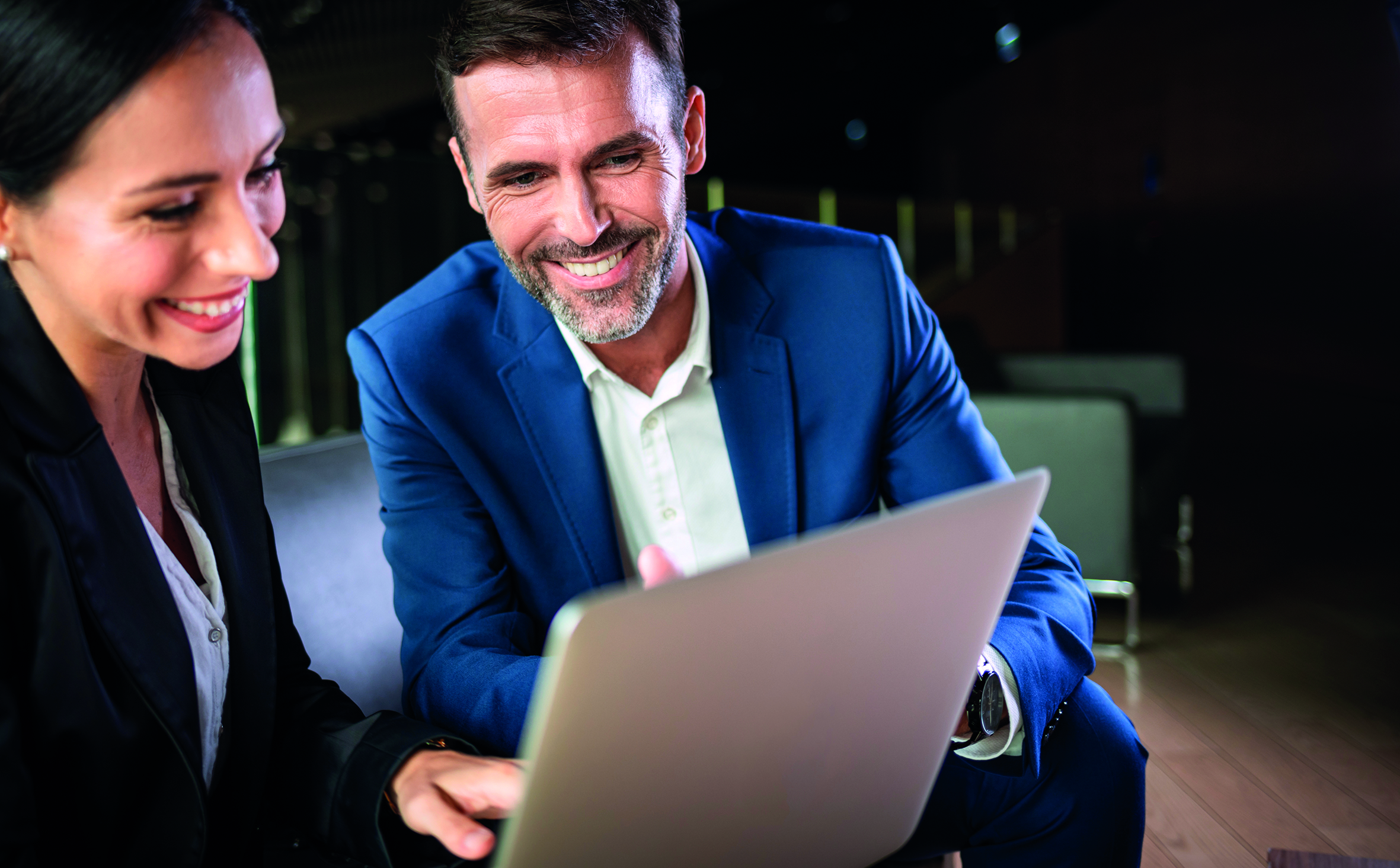 Businessman And Businesswoman Meeting In Modern Office