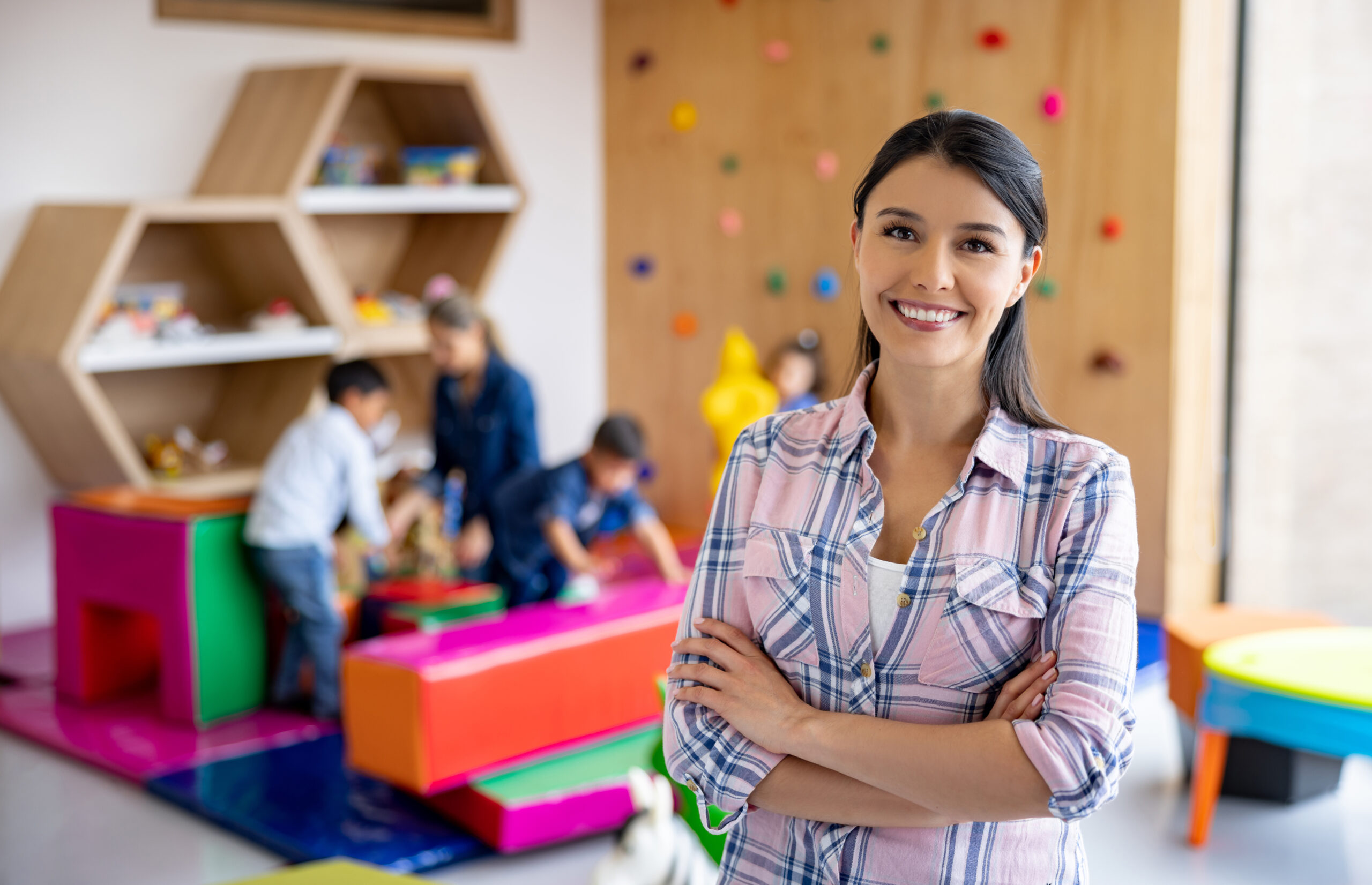 Happy Elementary School Teacher Smiling In The Classroom